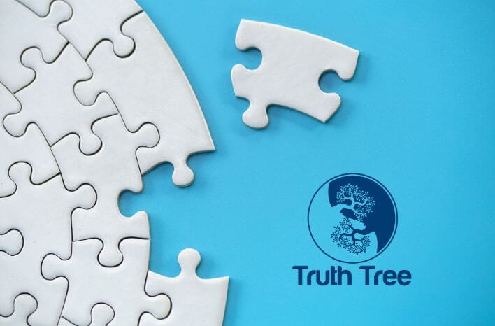 A single white puzzle piece sits offset from an assembled white puzzle. The offset piece is the last piece to complete the puzzle. The puzzle sits atop a bright blue background. In the bottom right section of the image sits the Truth Tree logo. | This image accompanies a career opportunity at Truth Tree | Truth Tree provides digital marketing strategies and solutions for schools.